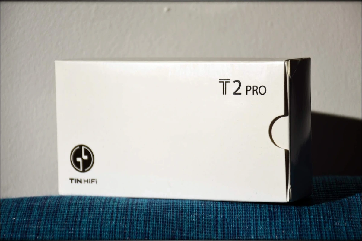 Tin T2Pro Package, resting on a blue surface, white background